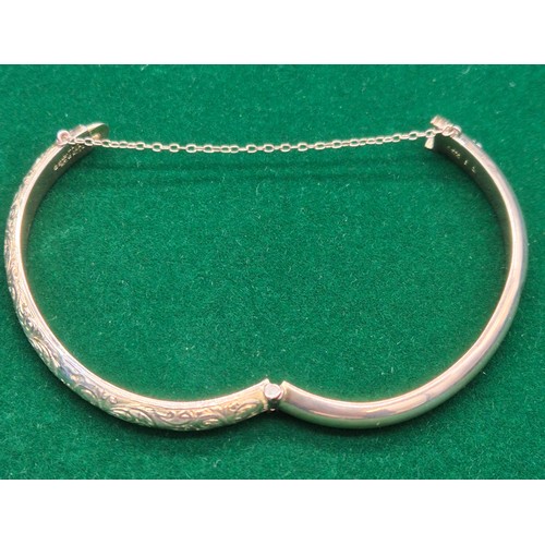 34 - Chester 9ct yellow gold engraved bangle. Dated 1899. [8.58grams]