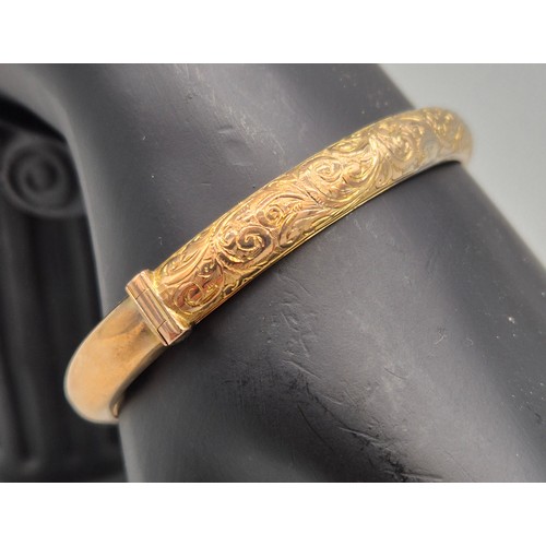 34 - Chester 9ct yellow gold engraved bangle. Dated 1899. [8.58grams]