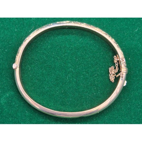 34 - Chester 9ct yellow gold engraved bangle. Dated 1899. [8.58grams]