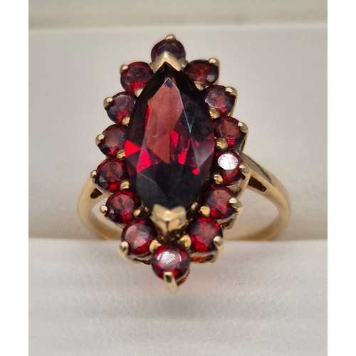 38 - 9ct yellow Gold Marquise Garnet Ring. [Ring size- M] [3.42grams]