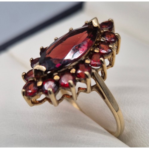 38 - 9ct yellow Gold Marquise Garnet Ring. [Ring size- M] [3.42grams]