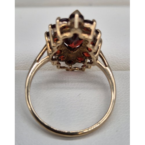 38 - 9ct yellow Gold Marquise Garnet Ring. [Ring size- M] [3.42grams]