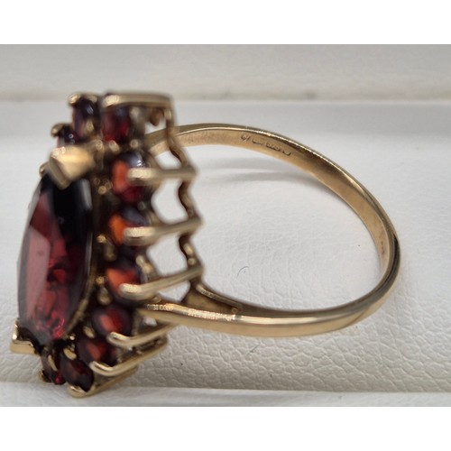 38 - 9ct yellow Gold Marquise Garnet Ring. [Ring size- M] [3.42grams]