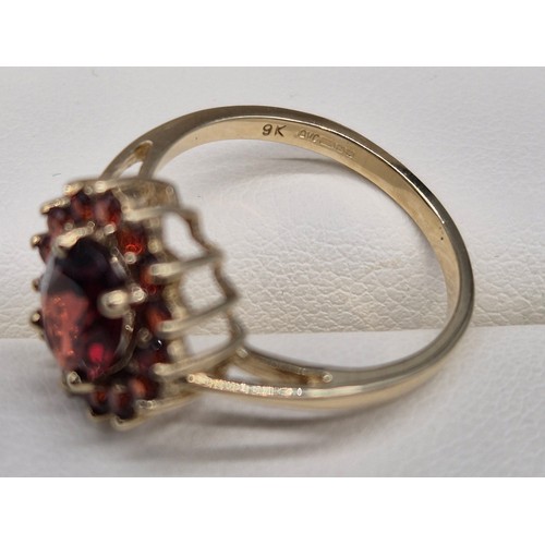 40 - 9ct yellow gold and Garnet cluster ring. [Ring size M] [2.39Grams]