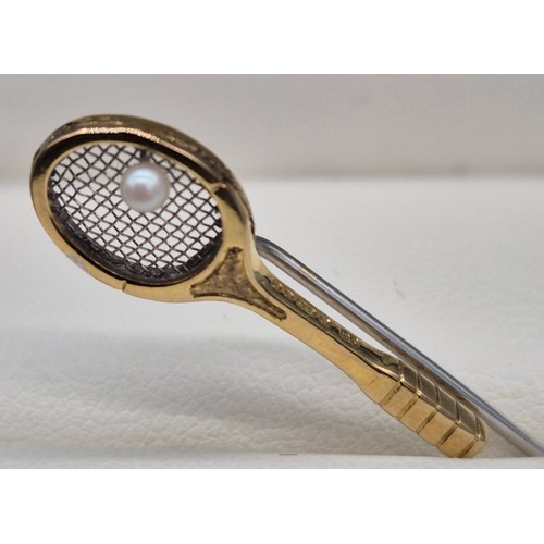 41 - 9ct yellow gold tennis racket pin badge. Fitted with a single pearl. [1.39grams] [4cm length]