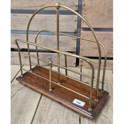 396 - Art Deco Magazine rack. Brass and oak made. Stamped S.H.&.S To the underside.