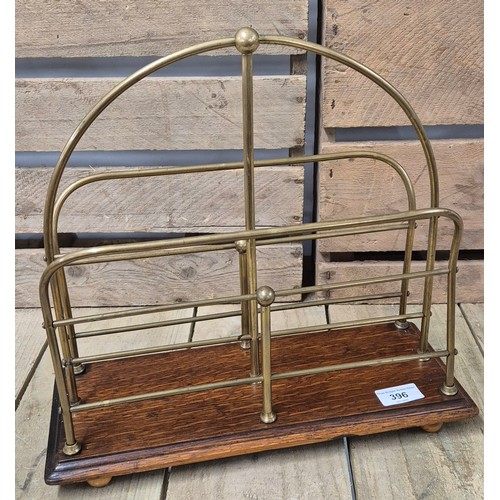 396 - Art Deco Magazine rack. Brass and oak made. Stamped S.H.&.S To the underside.