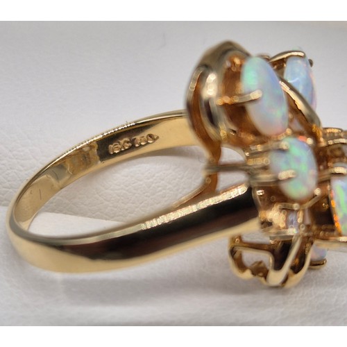 14 - 18ct yellow gold Opal and diamond stone ring. Fitted with six pear shaped opals and two round cut di... 