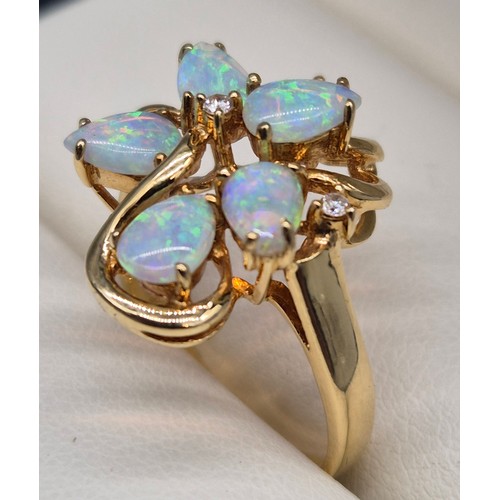 14 - 18ct yellow gold Opal and diamond stone ring. Fitted with six pear shaped opals and two round cut di... 