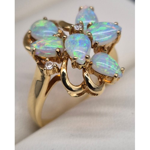 14 - 18ct yellow gold Opal and diamond stone ring. Fitted with six pear shaped opals and two round cut di... 