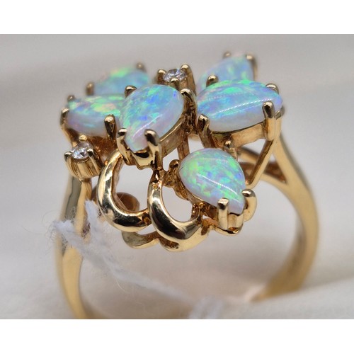 14 - 18ct yellow gold Opal and diamond stone ring. Fitted with six pear shaped opals and two round cut di... 