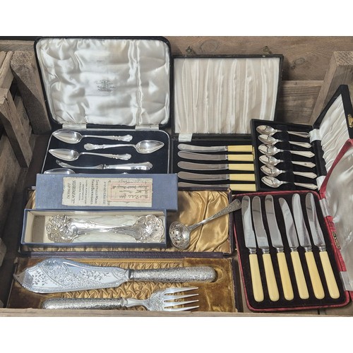 425 - Two crates of silver plated wares: Boxed cutlery sets, Selfridge & co containing two Berry spoons, B... 