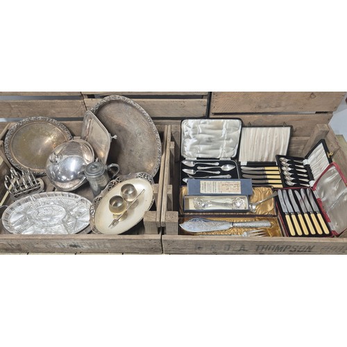 425 - Two crates of silver plated wares: Boxed cutlery sets, Selfridge & co containing two Berry spoons, B... 