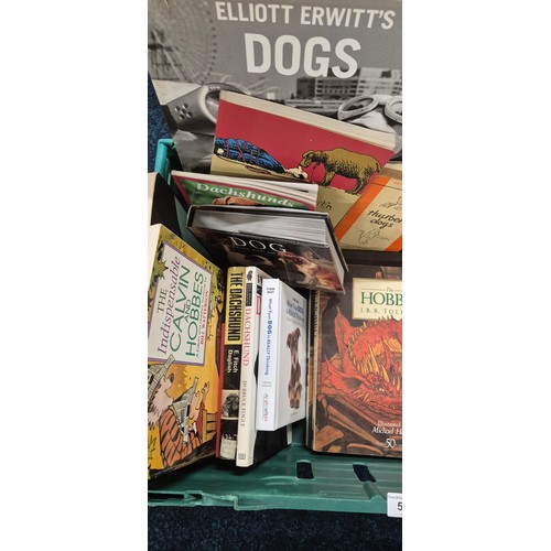 509 - A Large collection of Dog related books and mixed genre books to include The Hobbit. Calvin & Hobbs ... 