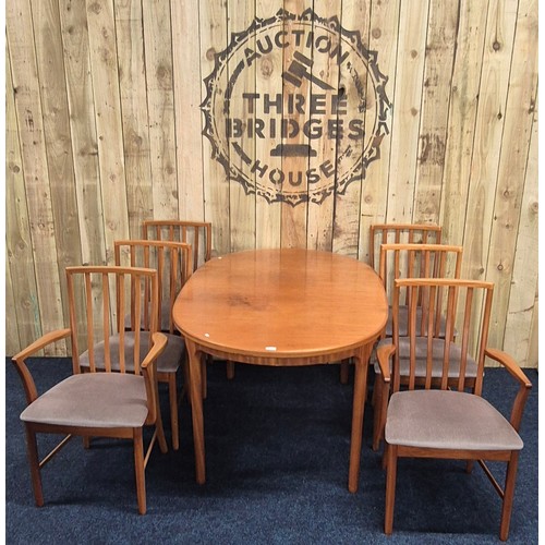 514 - Mid century McIntosh Kirkcaldy Teak Dining room Table Consisting of Two carver arm chairs & Four upr... 