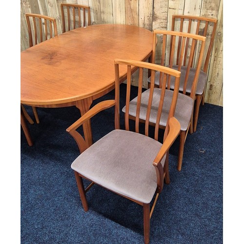 514 - Mid century McIntosh Kirkcaldy Teak Dining room Table Consisting of Two carver arm chairs & Four upr... 