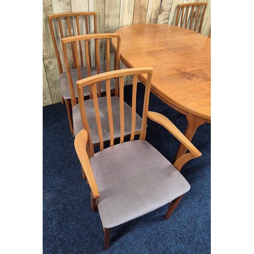 514 - Mid century McIntosh Kirkcaldy Teak Dining room Table Consisting of Two carver arm chairs & Four upr... 