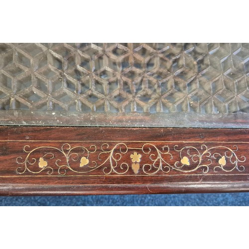 522 - Coffee table; made up of an Indian rosewood and inlaid top section and wrought iron base. [44x110x56... 