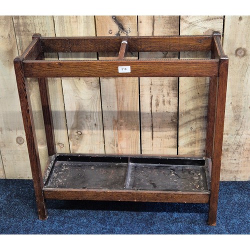 518 - Early 20th century oak stick stand, having metal drip trays present. [68x68x25cm]