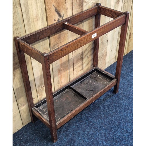 518 - Early 20th century oak stick stand, having metal drip trays present. [68x68x25cm]