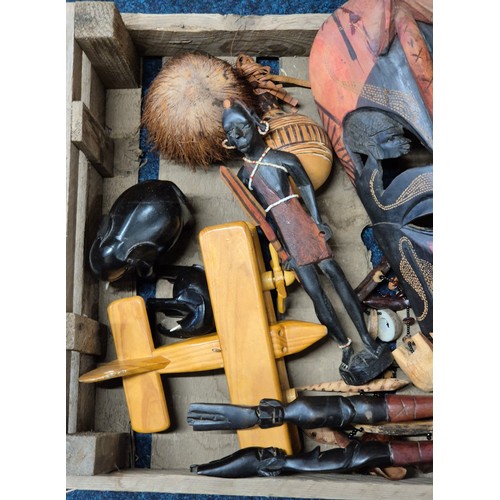 536 - Crate of African and wooden treen items; Kenyan hand carved wall mark, display weapons and other col... 