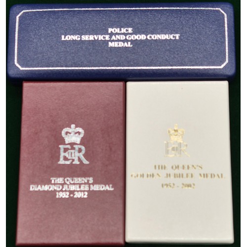 20A - Three boxed Police medals; Police Long service and good conduct medal. The Queens Gold & Diamond Jub... 