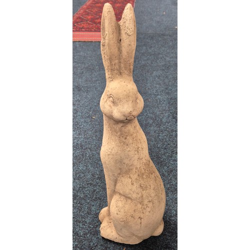 545 - Concrete garden sculpture of a Pagan hare. [58cm high]