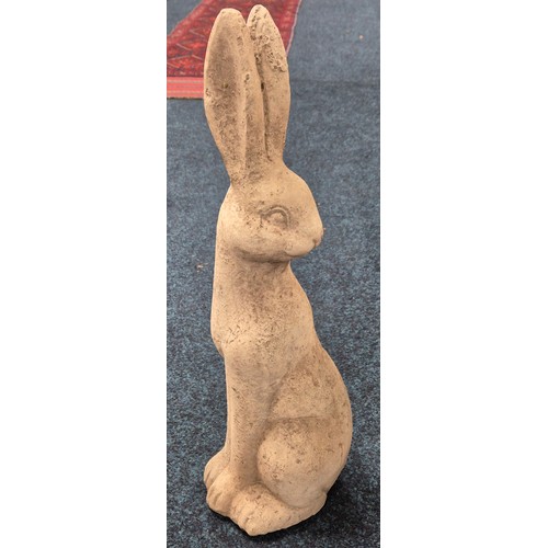 545 - Concrete garden sculpture of a Pagan hare. [58cm high]