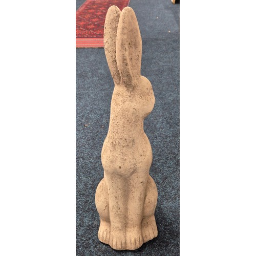 545 - Concrete garden sculpture of a Pagan hare. [58cm high]