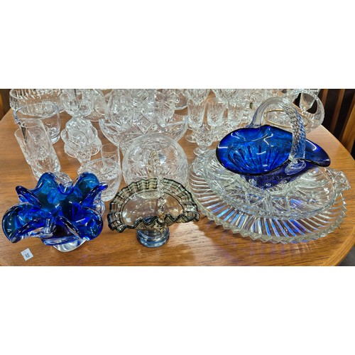 552 - A Large collection of crystal and glass ware; Decanters, candlesticks, vases and drinking glasses