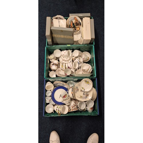 555 - Three crates of tea ware and ceramics; Wedgwood collectors plates, Royal Stafford tea set, Ansley ro... 