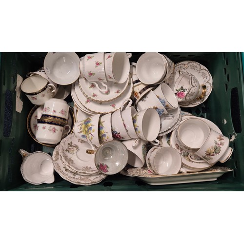 555 - Three crates of tea ware and ceramics; Wedgwood collectors plates, Royal Stafford tea set, Ansley ro... 