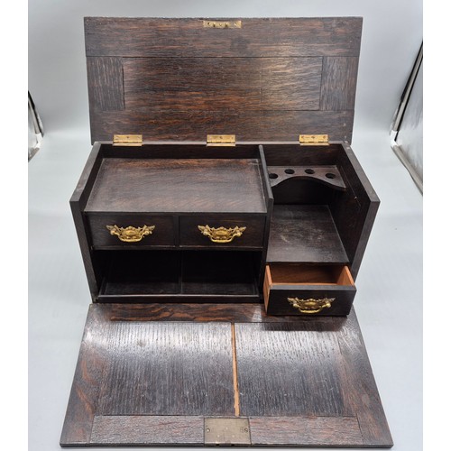 240A - Antique hand carved oak smokers chest together with a small vintage travel iron.