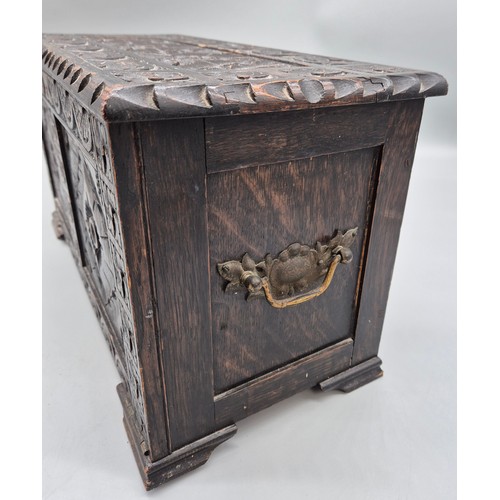 240A - Antique hand carved oak smokers chest together with a small vintage travel iron.