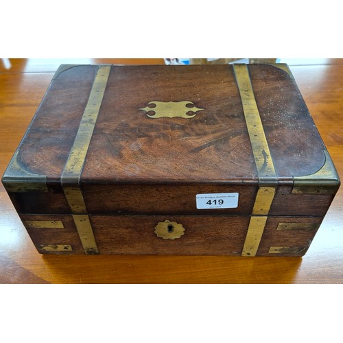 419 - 19th century mahogany and brass bound jewellery box containing lidded preserves. [13x30x22cm]