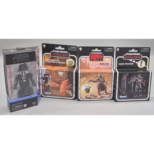 325 - A Collection of four Star Wars figures; The Mandalorian Dark Trooper & Incinerator Trooper & Grogu, ... 