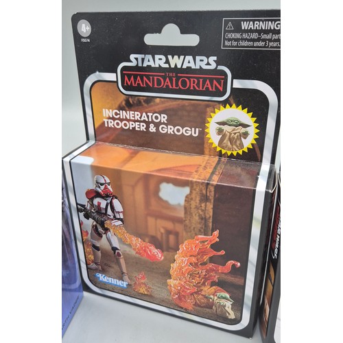 325 - A Collection of four Star Wars figures; The Mandalorian Dark Trooper & Incinerator Trooper & Grogu, ... 