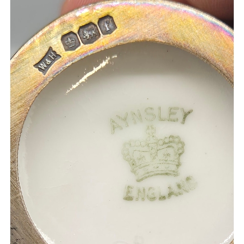 39 - Boxed Aynsley coffee can and saucers set fitted with Sheffield silver cup inserts. Comes within a pr... 