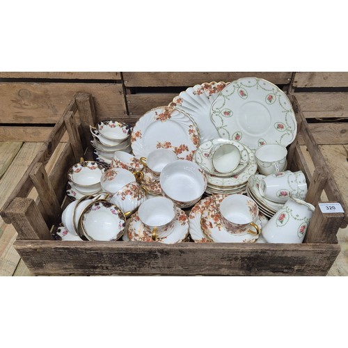 320 - A crate of vintage tea ware; Aynsley flower pattern tea service, Limoge flower pattern tea service &... 