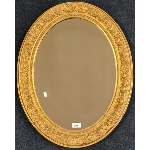 209 - 19th century moulded gilt frame mirror- oval form and having a bevel edge. [70.5x55cm]