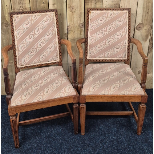 395 - A Pair of early 20th century open arm chairs