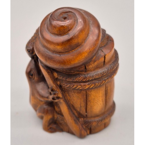 41 - Japanese hand carved boxwood netsuke in the form of a snail and toad on a barrel. Signed. [5.5cm hig... 