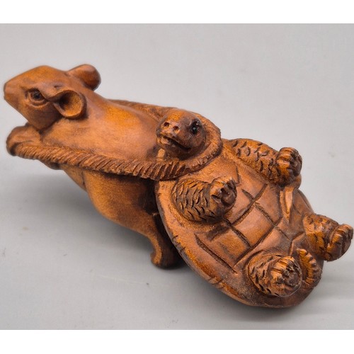 31 - Japanese hand carved boxwood netsuke in the form of a mouse pulling a turtle. Signed. [6cm length]