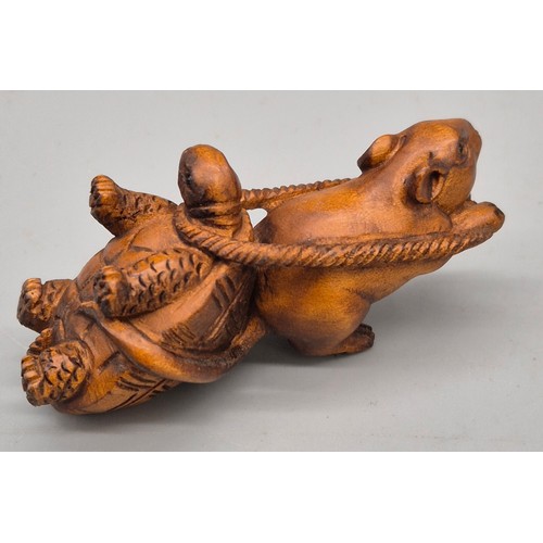 31 - Japanese hand carved boxwood netsuke in the form of a mouse pulling a turtle. Signed. [6cm length]