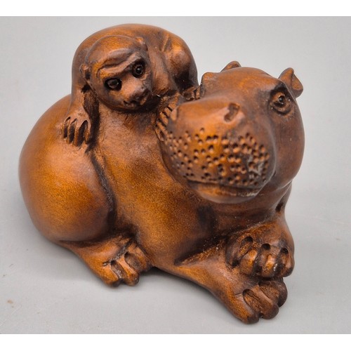 36 - Japanese hand carved boxwood netsuke in the form of a monkey sat upon a hippos back. Signed. [5cm le... 