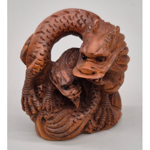 56 - Japanese hand carved boxwood netsuke in the form of two dragons huddled together. Signed. [4.5cm hig... 