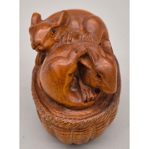 51 - Japanese hand carved boxwood netsuke in the form of a pair of mice within a basket. Signed. [4.5cm l... 