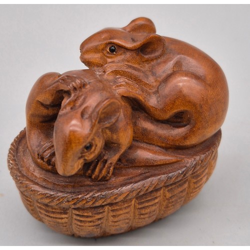 51 - Japanese hand carved boxwood netsuke in the form of a pair of mice within a basket. Signed. [4.5cm l... 