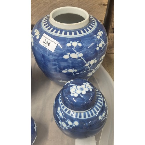 334 - A Collection of 19th and early 20th century Chinese blue and white blossom design lidded preserve po... 