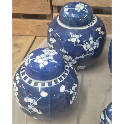 334 - A Collection of 19th and early 20th century Chinese blue and white blossom design lidded preserve po... 